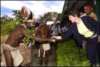 Image by Jason Dorday: PM Helen Clark shakes hands with Charles Kalweh (from the Anglicare Stopaids drummer group) after a tour of Anglicare Stopaids PNG centre.